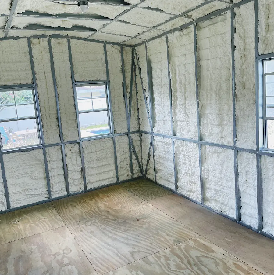 Closed-cell spray foam insulation applied to wall cavities in a residential project in Manchester